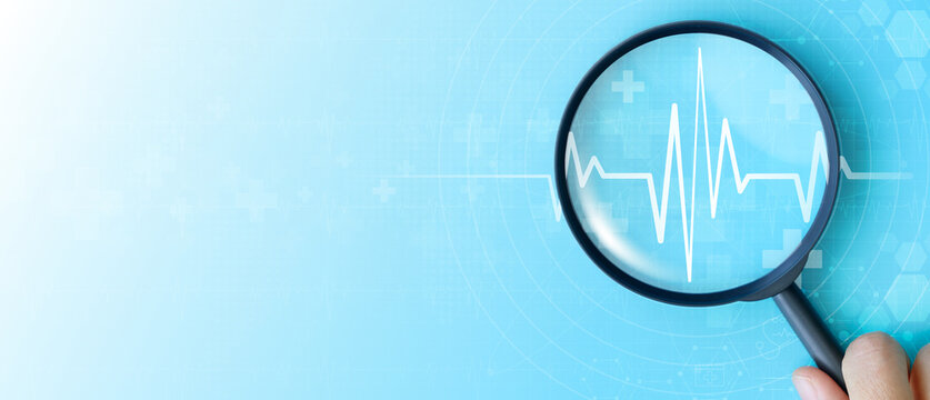 World heart day. focus heartbeat on blue background for checking the function of the patient heart. health insurance, love, international cardiology day, check up, heart attack and cardiology.