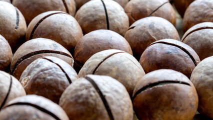 Macadami nuts on wooden background