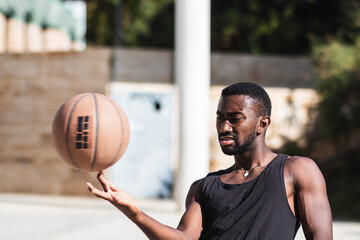 Basketball player spinning a ball