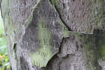 
a tombstone marked by time