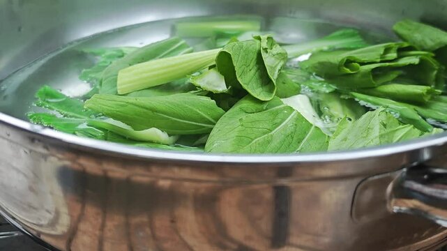 Baby green Bok Choy (Pak Choi) in hotpot.