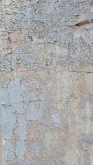 Peeling paint on an old wall. Grunge background for design.Selective focus