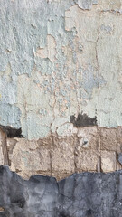 Peeling paint on an old wall. Grunge background for design.Selective focus