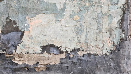 Peeling paint on an old wall. Grunge background for design.Selective focus