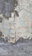 Peeling paint on an old wall. Grunge background for design.Selective focus