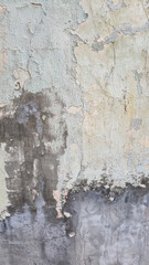 Peeling paint on an old wall. Grunge background for design.Selective focus