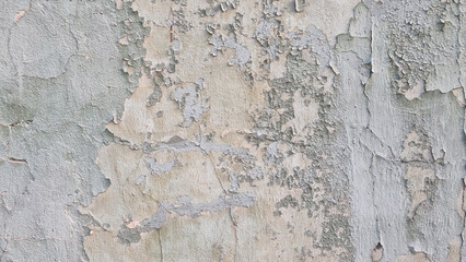 Peeling paint on an old wall. Grunge background for design.Selective focus