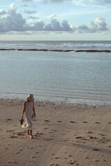 woman walking on beach