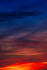 Background of the dawn sky with sunlight shining through the clouds creates a beautiful and fascinating color. 