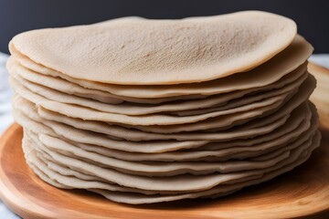 A stack of thin ethiopian injera bread with its spongy texture and slight sourness, AI Generated