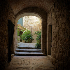 Obraz premium Entrance to the historic courtyard in the old town Girona, Catalonia, Spain, September 2019