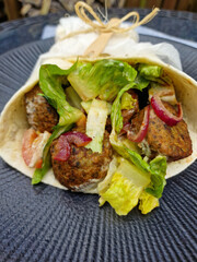 Vegan Falafel Wrap with Fresh Salad and Caramelized Red Onions