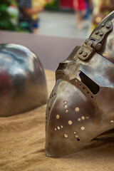 iron helmet with a folding visor close-up, part of the ammunition of a medieval warrior