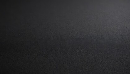 Obraz premium Close-up of a textured, black surface with a subtle gradient.