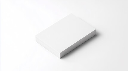A stack of white business cards on a white surface