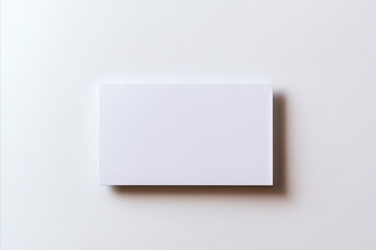 A blank white card on a white surface