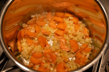 Carrot and onion in the pan.