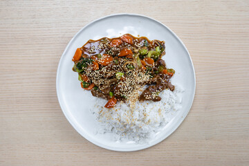 Beef and vegetable stir fry with rice.