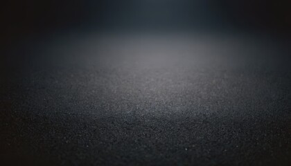 Close up of a dark, textured, and blurred surface.