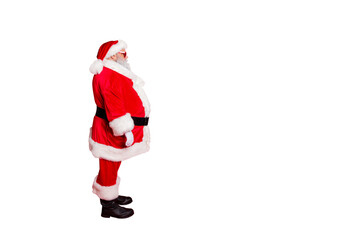 Full size profile side photo of brutal funny fat santa claus with big abdomen on christmas night wear sunglass isolated over red color background