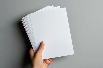 Hand holding a bunch of blank paper. Created with Ai