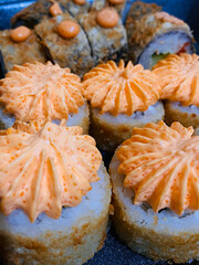 Sushi roll japanese food style on a black background
