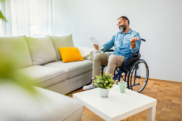 Man in Wheelchair Conversing Happily on Tablet at Home