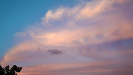 Evening scene. Sky blue and purple sunrise on background. Natural background, blue sky with purple clouds. Scenic travel background. Nature background.