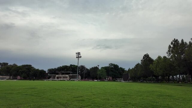 Empty Cricket Stadium with sky background