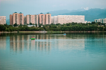 city skyline with lake