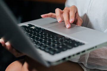 Person Working on Laptop in Dim Light