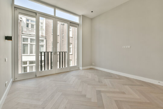 Spacious Empty Room with Herringbone Pattern Floor
