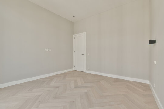 Modern empty room with herringbone parquet floor