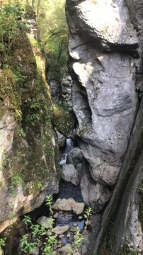 Video of a Large Stone Stuck between the Rocks of the Mountain with the Soča River Below. Slovenia during Summer. Tolmin Gorge, Julian Alps 