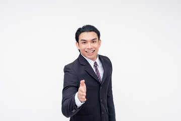 A young asian business executive offering a handshake, coming to an agreement. Isolated on a white background.