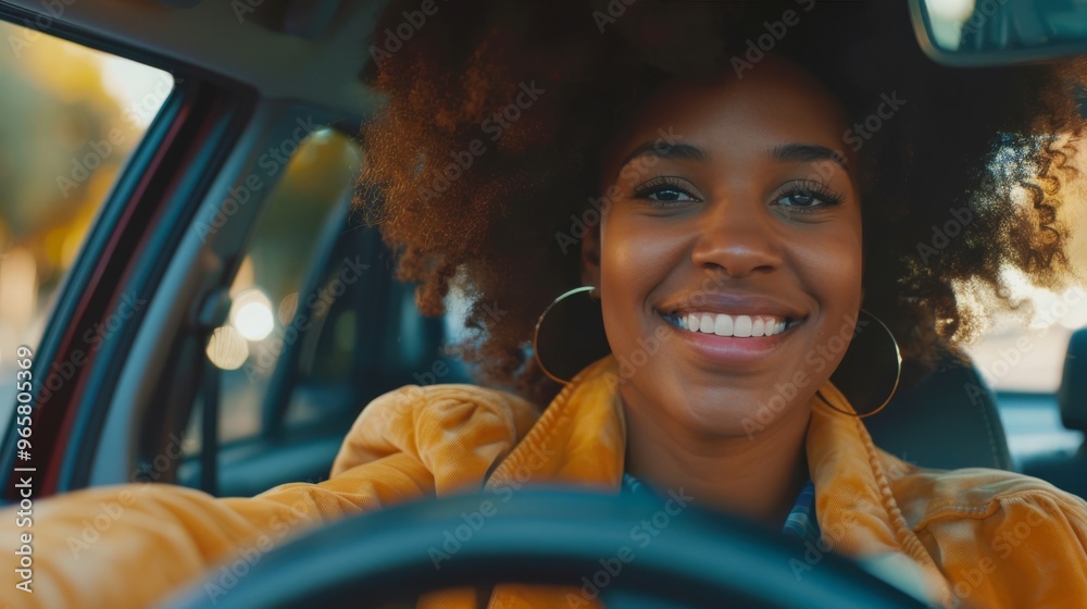 Canvas Prints Smiling Afro person in the driver's seat of a modern vehicle