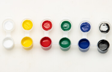 A row of paint tubes with different colors