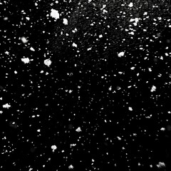 Snow falling on black background