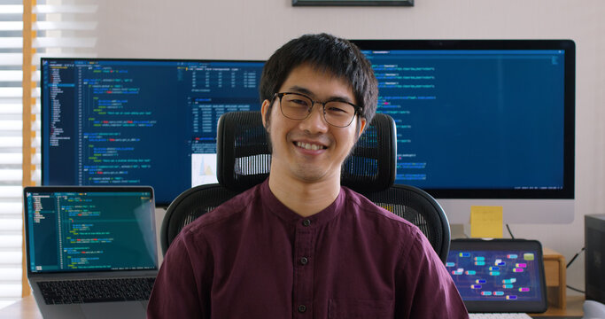 Digital transformation future workforce web DEV career. Asia people young talent man relax smile look at camera remote work at home office reskill upskill job on AI cloud computing cyber security.