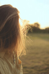 woman looking at sunset
