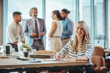 Smiling Businesswoman Working in Modern Office Environment