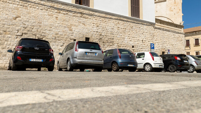 Cars parked in the historic center. Bari, Italy - September 2024