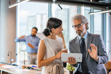 Business Colleagues Discussing Ideas in Modern Office Environment
