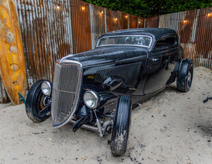 Black street rod style American classic car. at the beach. © Robert L Parker