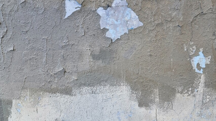 Peeling paint on an old wall. Grunge background for design.Selective focus