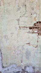 Peeling paint on an old wall. Grunge background for design.Selective focus