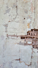 Peeling paint on an old wall. Grunge background for design.Selective focus