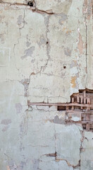 Peeling paint on an old wall. Grunge background for design.Selective focus