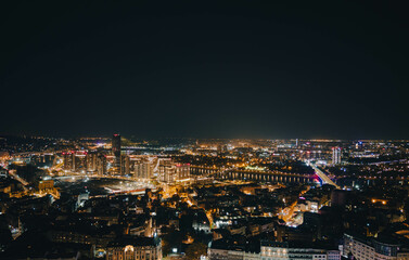 Fototapeta premium Aerial view of Belgrade showing the contrast between the historic Old City and modern New Belgrade skyline. Ideal for urban, travel, and architecture projects.