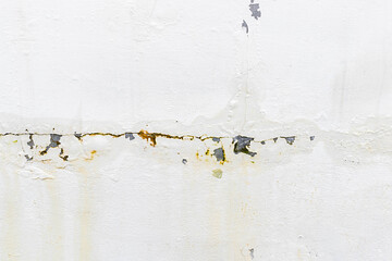 The concrete wall is cracked and water is seeping through.